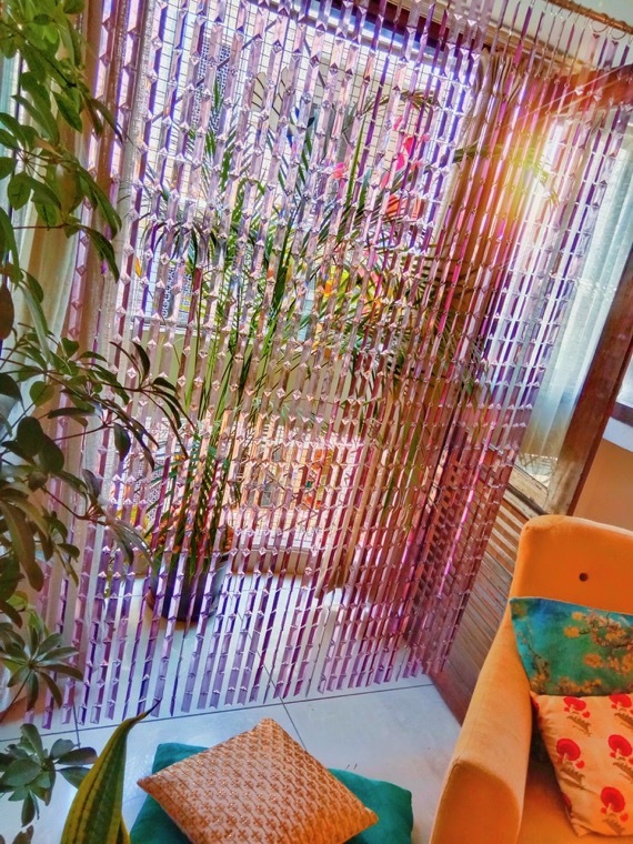 Beautiful Living Room Interiors With Coordinated Purple Bead Curtain