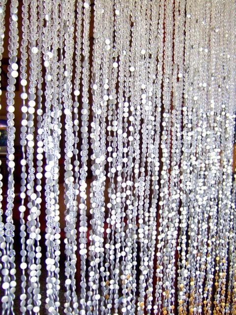 living room archway white silver beads curtain