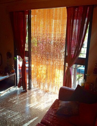 shimmering bead curtain draped in sunlight